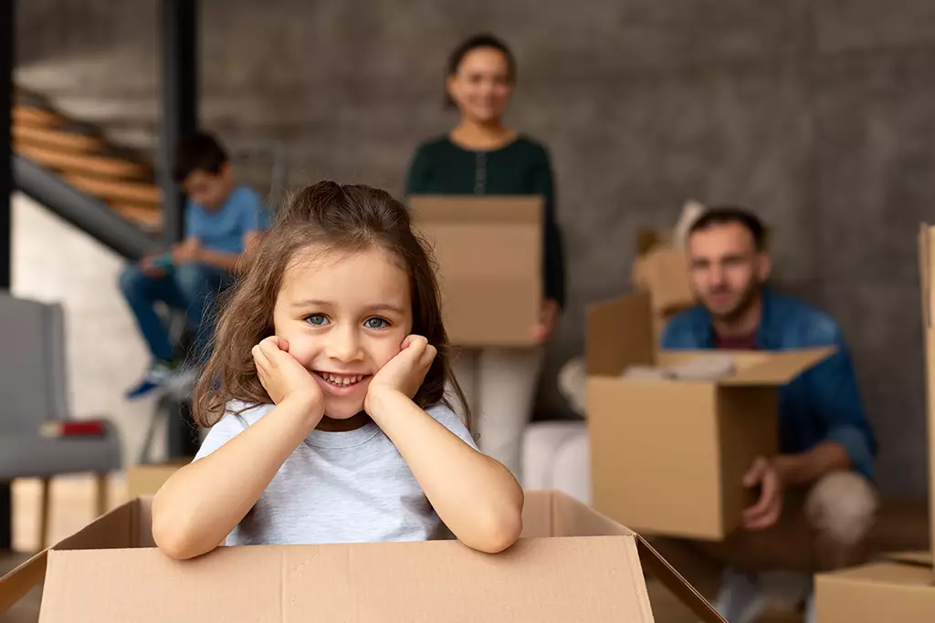 Child Inside The Box Smiling